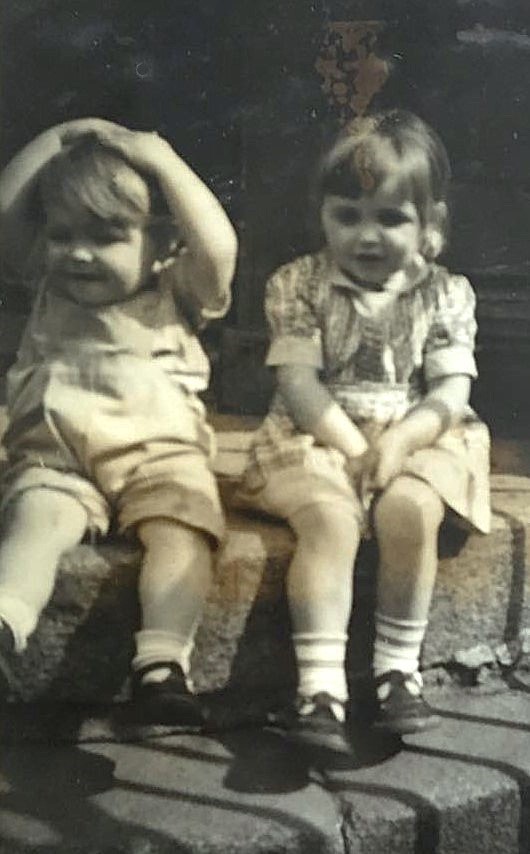 Respondent Mike Kelly With Big Sister Evelyn, Born 1950, On The Front Steps Of 13 Hydepark Street, Glasgow, In 1954. Courtesy Of Mike Kelly image