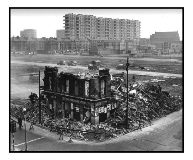 Tower Blocks In Background Partially Demolished Slums In Foreground image