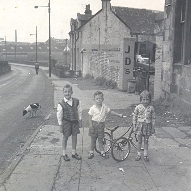 Three Weans, A Three Wheeler Bike And One Street Dug. Before The Multis Went Up In Sighthill, C.1964 image